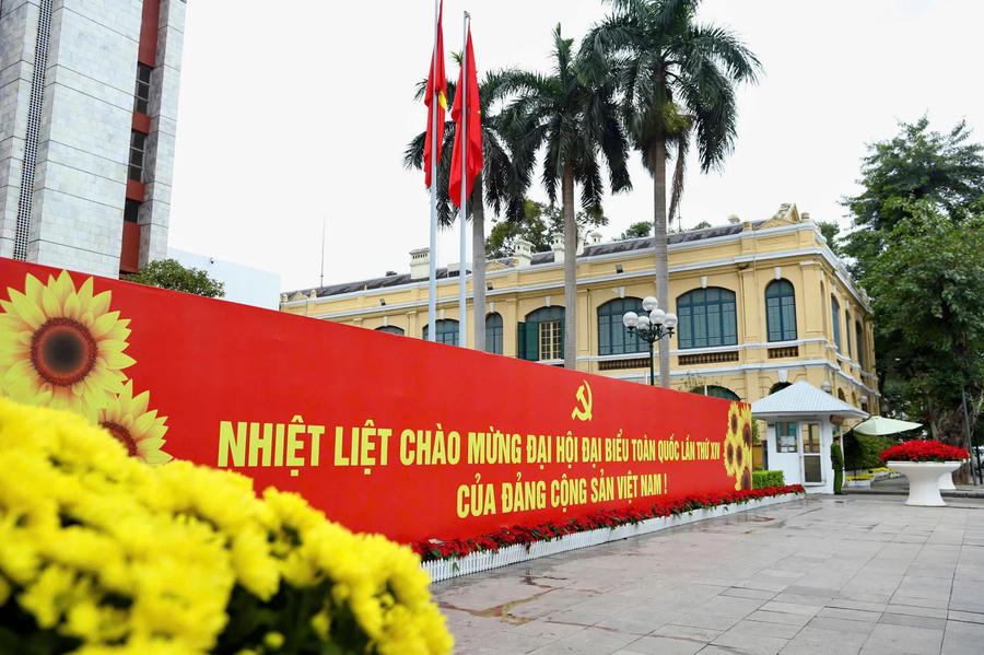 Posters and slogans appear across facades, intersections and public buildings, integrated thoughtfully into the urban fabric rather than imposed upon it.