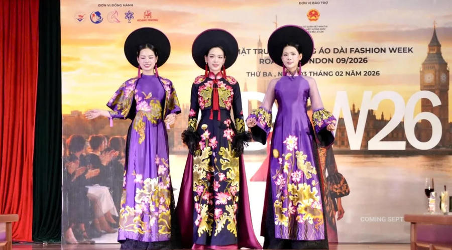 Top three Miss Tourism Vietnam contestants present ao dai designs by meritorious artisan Lan Huong. Photo: SCOV