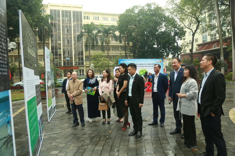 Delegates tour the exhibition. It forms part of a seminar reviewing P2ACE results and setting goals for the next phase. Photos: Pham Hung/The Hanoi Times